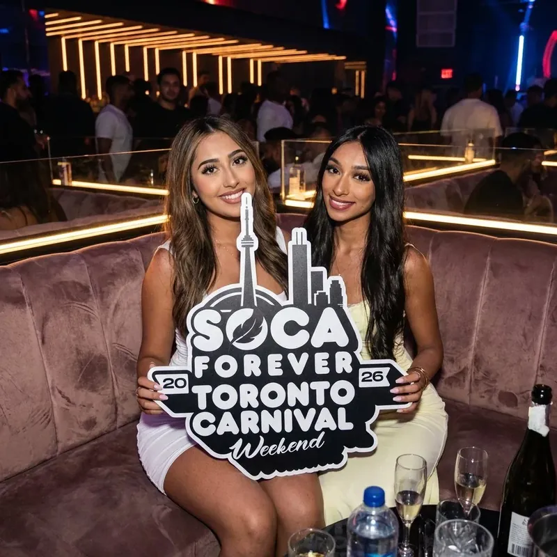 Champagne booth at a past Soca Forever fete with the branded sign